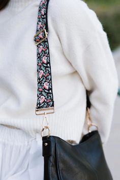 Add a touch of excitement to your wardrobe with our Botanical Bliss Strap. Made from a soft, woven like material, this strap features exquisite orange flowers and delicate teal leaves that are beautifully stitched. This adds a unique and stylish touch to any bag. This strap is paired with the Marcella Bag in the photos. Botanical Strap Details: Adjusts from 32" - 58" in length 2" wide Gold hardware Polyester material. Woven feel, thicker strap Adjustable Bag Strap, Adjustable Bag, Convertible Bags, Chic Bags, Quiet Luxury, Saddle Bag, Modern Chic, Jewelry Case, Watch Necklace