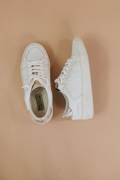 Secured to be a standout, this classic leather sneaker truly elevates any look. This sneaker white and gold design, gold metallic detailing, and a comforting true to size fit. Style these standout sneakers all year long! 100% Leather Imported Rubber sole Fit: true to size Synthetic/Leather upper Need help with sizing? No problem! Join our VIP group on Facebook, Everyday Chic Boutique VIP Insiders to chat directly with our team and other customers just like you.Packaged with love and shipped from Hip Style, Vip Group, Everyday Chic, Everyday Activities, Fit Style, Classic Leather, Chic Boutique, Gold Design, Synthetic Leather