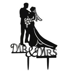 a wedding cake topper with a bride and groom silhouette on it's side