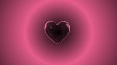 a heart shaped object in the middle of a pink circle with light swirling around it