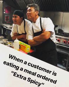 two men standing in front of a sign that says, when a customer is eating a meal ordered extra spicy