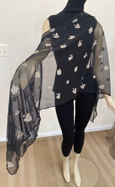 Extra long black and beige embroidered floral wrap scarf. For formal occasions and evening wear. Generously sized to cover women sizes ranging from S-XL. 70" long x 28" wide. Gentle hand wash, air dry. Do not iron. Elegant Black Festive Shawl, Evening Dupatta With Floral Embroidery In Traditional Drape, Elegant Black Scarves For Festive Season, Elegant Black Scarf For Festive Season, Elegant Black Festive Scarves, Black Formal Shawl For Festive Occasions, Elegant Black Shawl For Festive Occasions, Festive Formal Black Shawl, Elegant Black Shawl Dupatta