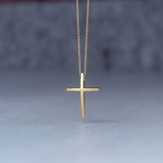 Minimal solid gold handmade cross necklace, curved 14k solid gold cross pendant. This is a beautiful handmade minimal cross with a curved front that makes it a bit different and unique. Available in 14k yellow and 14k white gold , please make your choice from the drop down menu. Minimal cross necklace, unisex pendant. Size: 1,7 cm / 0.7 inches long and 0.7 cm / 0,3 inches wide Material: 14k solid yellow gold or 14k solid white gold You can choose the charm with a yellow gold filled chain (white Dainty 14k Gold Cross Necklace Gift, Dainty 14k Gold Cross Necklace As A Gift, Classic 14k Gold Cross Necklace For Gift, Classic 14k Gold Cross Necklace As Gift, Minimalist Crucifix Necklace As A Gift, Minimalist Crucifix Necklace For Gift, Yellow Gold Pendant Cross Necklace For Gift, Yellow Gold Cross Pendant Necklace Gift, Yellow Gold Pendant Cross Necklace As Gift