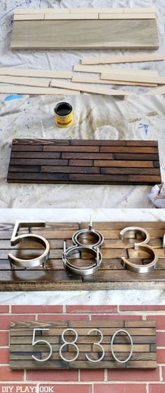 some metal rings are sitting on top of a piece of wood and next to a sign that says 350