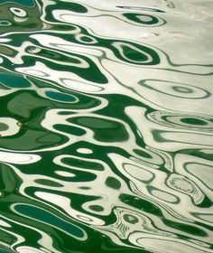 the water is green and has wavy lines