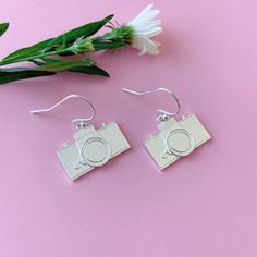 Camera earrings, sterling silver camera earrings, camera jewelry, photography, gift for photographer, Instagram photographer  These handmade camera earrings are made in sterling silver. They are minimal and simple yet you can see all the details.They make perfect gift for a photographer friend or an artist person! They are a must have! They are light and comfortable for casual use or special events. Dimensions:  Camera: 1.9 cm x 1.1 cm Drop length: :1.2 cm Camera Earrings, Camera Jewelry, Gift For Photographer, Bird Watcher Gifts, Photographer Instagram, Gifts For Photographers, Bird Earrings, Tiny Stud Earrings, Jewelry Photography