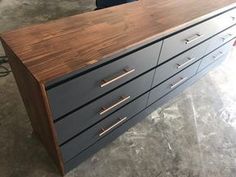 a large wooden dresser sitting on top of a floor