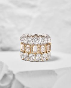 a gold and white ring with diamonds on it