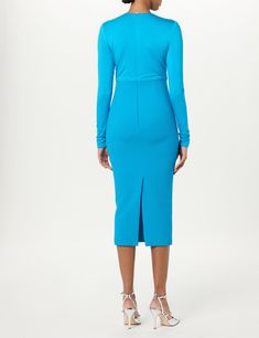 Asymmetric ruched cocktail dress with knit jersey bodice and wool crepe skirt. 95% Bamboo | 5% Spandex 100% Wool Lining: 91.5% Silk | 8.5% Lycra Dry clean only Made in USA Free Domestic Shipping Elastane Midi Dress With Ruched Sides, Elastane Midi Dress With Ruched Bodice For Night Out, Party Ruched Midi Dress In Elastane, Chic Bodycon Dress With Ruched Bodice, Party Long Sleeve Midi Dress With Ruched Sides, Party Midi Dress With Ruched Sides And Long Sleeves, Ruched Elastane Midi Dress For Work, Chic Dress With Ruched Sides, Chic Elastane Bodycon Dress With Ruched Sides