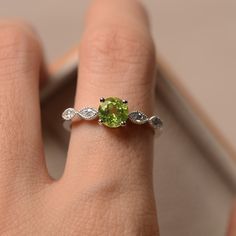 Peridot Birthstone Ring In White Gold, Peridot Round Cut Diamond Ring, Peridot Diamond Ring With Round Cut, Silver Peridot Birthstone Ring With Accent Stones, Lime Green Gemstone Birthstone Ring For Anniversary, Peridot Birthstone Ring Round Cut, Silver Peridot Ring With Round Cut, Peridot Birthstone Ring For Promise Occasion, Silver Birthstone Ring With Peridot And Accent Stones