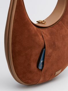 Luxury Brown Leather Hobo Bag, Luxury Suede Hobo Bag With Leather Handles, Designer Leather Hobo Bag For Work, Suede Shoulder Bag With Suede Lining For Work, Luxury Brown Soft Leather Hobo Bag, Elegant Suede Bag With Removable Pouch, Suede Shoulder Bag For Work, Brown Business Bags With Round Handle, Brown Suede Shoulder Bag For Work