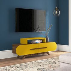 a living room with blue walls and a yellow entertainment unit in the corner, next to a white couch