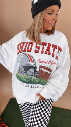 The Huddle Up Ohio Crewneck Sweatshirts. A game day essential for Ohio football fans, this crewneck is essential to create the ultimate College game day look. Oversized crewneck Ohio Oversized graphic crewneck Ohio Sweatshirt Oversized fit - SIZE DOWN for truer to size fit Game day graphic crewneck Round neckline Measurements/Sizing: (Approximate. Measured lying flat.) ***Very oversized fit. Size down for a truer to size fit. XS- Size 4/6 Length 26 1/2" S- Size 8/10 Length 27 1/2" M- Size 12/14 White Oversized Sweatshirt For Game Day, Game Day White Relaxed Fit Sweatshirt, Oversized School Spirit Sweatshirt With Graphic Print, Oversized School Spirit Graphic Sweatshirt, Oversized Graphic Print Sweatshirt For School Spirit, White Relaxed Fit Sweatshirt For Game Day, Collegiate Sweatshirt For Football Season, Collegiate Sweatshirt For Game Day, Collegiate Sweatshirt For College Football Season