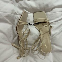 Brand New With Tags. Came With These Little Marks- Genuinely Not Noticeable At All. Feminine Cream Low Heel Sandals, Cream Square Toe Sandals For Evening, Evening Sandals With Square Toe In Cream, Cream Sandals With Square Toe For Evening, Elegant White Strappy Sandals, Cream Sandals With Heel Strap And Square Toe, Chic White Strappy Sandals, Elegant Cream Strappy Sandals, Feminine Cream Sandals With Heel Strap