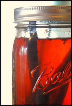 a jar filled with liquid sitting on top of a table