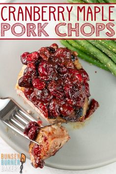 cranberry maple pork chops on a plate with green beans