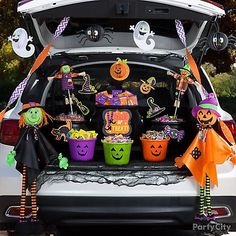 the trunk of a car decorated with halloween decorations