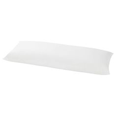 a white pillow sitting on top of a table