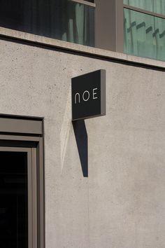 a noe sign on the side of a building