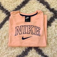 Never Worn, Light Pink & Navy Blue Striped Sleeve Nike Pink Tops With Letter Print, Nike Pink Top With Logo Print, Pink Nike Tops With Letter Print, Pink Athleisure T-shirt For Spring, Trendy Nike Spring T-shirt, Trendy Nike T-shirt For Spring, Nike Athleisure T-shirt For Spring, Nike Spring Athleisure T-shirt, Trendy Pink Nike Tops