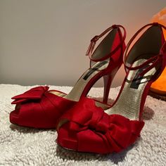 Nwt , No Box. Nina Red Rouge Luster Satin Peep Toe Heels With Bow And Ankle Strap. Heel Is Approximately 4.75”. Quince Heels Red, Red Ankle-high Heels With 4-inch Heel, Red Open Toe Heels For Evening, Red Ankle-high Heels With Heel Strap, Party Heels With Red Bow And Round Toe, Red Ankle Strap Heels For Evening, Red Ankle-high Evening Heels, Elegant Ankle-high Red Heels, Red Heels With Round Toe And Bow