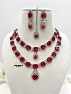 2 layered American Diamond Necklace Set / CZ Necklace/Indian Jewelry/ Reception Jewelry/ Bollywood Jewelry/double layer necklace/Silver red All items are shipped from Brampton, Ontario, Canada. If you need your item by a certain day, please reach out to us for express delivery option before placing the order so that we can update the shipping for you. Standard shipping/delivery timeline Below are the estimated delivery times after the order is shipped/dispatched.  ---> USA delivery timeline * 3- Red Double Strand Party Jewelry, Red Double Strand Jewelry For Party, Double Strand Red Jewelry For Party, Red Double Strand Necklace For Party, Luxury Red American Diamond Jewelry Sets, Red American Diamond Jewelry Sets For Wedding, Red Crystal Necklaces With Jewels, Traditional Red Diamond Necklace, Red Crystal Necklace With Jewels