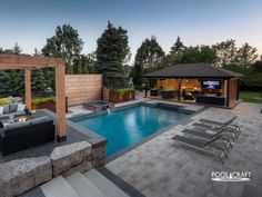 a backyard with a pool and patio furniture