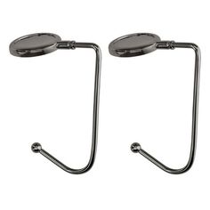 two metal hooks on the side of a white wall