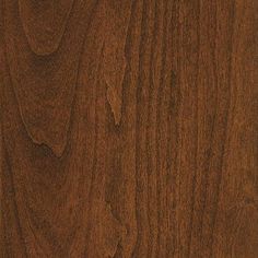 a close up view of the wood grains on this wooden flooring material, which looks like it has been stained brown