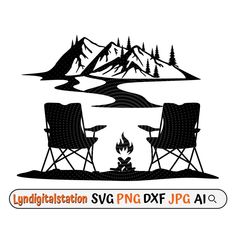 two chairs sitting next to each other in front of a campfire with mountains and trees