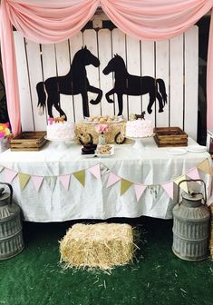 a horse themed birthday party with pink and gold decorations, straw bales and hay