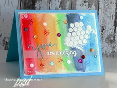 a colorful card with buttons and words on the front that says you are amazing in blue