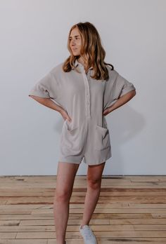 Details: Ribbed Button Down Romper Loose fit Super soft fabric Side pockets Taupe color Sizing: Fits true to size (model wearing size small) Button-up Loungewear Tops With Pockets, Comfy Solid Color Tops With Pockets, Button-up Tops With Pockets For Loungewear, Comfy Solid Tops With Pockets, Button-up Lounge Tops With Pockets, Relaxed Fit Tops With Pockets For Lounging, Taupe Color, Chic Boutique, Soft Fabric