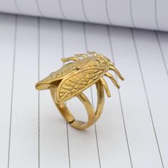 * Free Surprise Gift on Purchase of 1 Product. * Purchase of 4 Product and Get 2 Rings Free Gifts. Product :- Ring Material :- Brass Size :- All Size Available  Gold Cicada Beetle Ring, Garden Bug Scarab Jewelry, Insect Ring, Nature Study Steam Punk, Gift for Him, Halloween Ring, Large Statement Ring   * All our products are handmade and we make them as you see in the    photography but because of handmade There may be a slight difference in them * Handling Time: We take handling time of 1-3 Business Day from the date of receipt of the payment * Shipping Services: The shipping company takes 5-15 business days to deliver the product to US and most of other countries       For any queries Please feel free to message us. * Normally we respond in maximum 24 hours. * Gift packaging is available Scarab Jewelry, Beetle Ring, Bug Ring, Insect Ring, Halloween Ring, Garden Bugs, 2 Rings, Brass Band, Nature Study