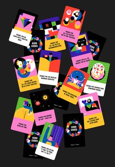 many different colored cards on a black background