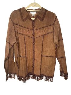 Dressbarn Vintage Leather Suede & Crochet Brown Patchwork Embroidered Jacket Med small mark on front (pictured), overall excellent pre owned condition fringe on hem, boho, floral embroidered front Penny Lane, Daisy Jones >> size medium >> bust 40" >> length 25" >> sleeve 22" >> 2" fringe All measurements are approximate. Please check the measurements, vintage and pre owned items vary in size. I identify all known flaws, please note the pictures as additional description to the condition. I ship Winter Festival Outerwear With Beaded Fringe, Bohemian Long Sleeve Fringe Outerwear, Bohemian Winter Outerwear With Beaded Fringe, Bohemian Festival Outerwear With Beaded Fringe, Bohemian Brown Outerwear With Tassels, Fitted Bohemian Outerwear With Tassels, Long Sleeve Beaded Fringe Festival Outerwear, Western Long Sleeve Outerwear With Tassels, Western Style Long Sleeve Outerwear With Tassels