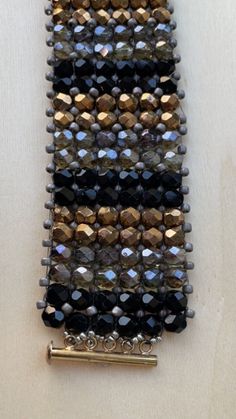 a close up of a bracelet with beads on it