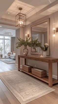 a living room filled with furniture and a large mirror on top of a wooden table