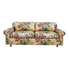 a couch with floral fabric on the back and arms, sitting in front of a white background