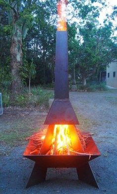 a fire pit sitting in the middle of a field