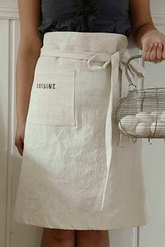 a woman wearing an apron holding a basket with eggs in it and the words sunshine written on it