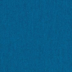 a bright blue background with small dots