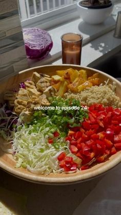 a wooden bowl filled with different types of vegetables