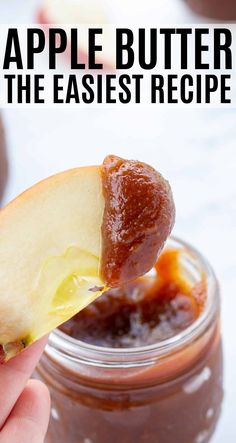 a hand holding an apple butter with the words how to make apple butter on it