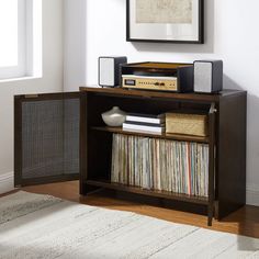 an entertainment center with record player, stereo and speakers