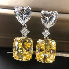 SKU#: OB148ER Earrings InformationMetal: 925 Sterling SilverPlating Color: SilverPrimary InformationStone Type: Lab-Created GemstoneStone Color: Fancy Yellow & WhiteStone Shape: Cushion Cut & Heart CutStone Size: 10*12mm (Cushion Cut) 8*8mm (Heart Cut)Stone Setting: Prong *All stone weights (CT.) are approximate and listed as diamond equivalent weight in carats. Also total weight of the Earrings, Earrings width & thickness may have a slight deviation no more than 5%.*Photos may be enlarged to sh Big Diamond Earrings, Yellow Diamond Earrings, Neon Nike, Diamond Earrings Wedding, Yellow Diamond Earring, Crystal Crown Wedding, Canary Diamond, Yellow Cushion, Crystal Earrings Wedding