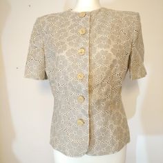 A wonderful jacket by Italian luxury fashion house Valentino. Ready to wear Miss V brand. Cream linen in a large floral print. Fastens at the front with large wooden buttons. Has shoulder pads. Short sleeves. Fully lined in a shiny cream fabric - probably Rayon. UK size 12 or European size 46. Definitely 80s or early 90s. Measured flat the chest is 36 inches or 92 centimetres. Length is 22 inches or 56 centimetres. Excellent condition!! It's a simple beige colour, so you can pair it with almost anything! We deliver worldwide and have listed postage and delivery for countries in Europe and worldwide. Please message us for postage costs if your country of residency has not been listed and you are interested in purchasing this item! And please note we don't accept returns, exchanges or cancel Beige Summer Blazer With Button Closure, Summer Beige Blazer With Button Closure, Elegant Beige Single Breasted Top, Elegant Beige Single-breasted Top, Vintage Beige Outerwear For Summer, Vintage Beige Summer Outerwear, Vintage Beige Blazer For Spring, Vintage Single Breasted Tops For Spring, Vintage Cream Blazer For Spring