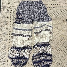 Boho Pants For Women. Nwot. Navy And Ivory. With Floral And Elephant Print. Elastic Waistband With Ties. Pocket On The Side And Elastic Bottoms. 100% Rayon Bohemian Style Cream Bottoms With Elastic Waistband, White Bohemian Bottoms With Elastic Waistband, Bohemian White Bottoms With Elastic Waistband, Cream Bohemian Bottoms For Vacation, Bohemian Cream Bottoms For Vacation, White Bohemian Pants With Elastic Waistband, Bohemian White Pants With Elastic Waistband, White Bohemian Harem Pants For Vacation, White Bohemian Pants With Pockets