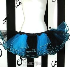 "The tulle is bright Turquoise Blue and Black bridal quality and it's super soft on your skin. The bottom hem is trimmed with black piping. It makes this extremely full and pouffy. All of the ruffles are hand gathered, stitched and serged to make this durable. It's washing machine and dryer safe for years of wear. Just remember that this skirt is only 10 inches long and even though it's very full...it's still pretty sheer. You might want to wear it over something. Measurements: Small: 24\" to 32 Blue Stretch Skirt For Dance, Fitted Blue Skirt With Attached Cancan, Hartford Ct, Black Bridal, Washing Machine And Dryer, Bright Turquoise, Scene Kids, Blue Pin, Tutu Skirt