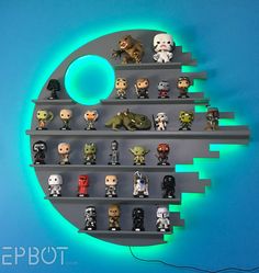 star wars action figures are displayed on a shelf with blue lights in the shape of a circle